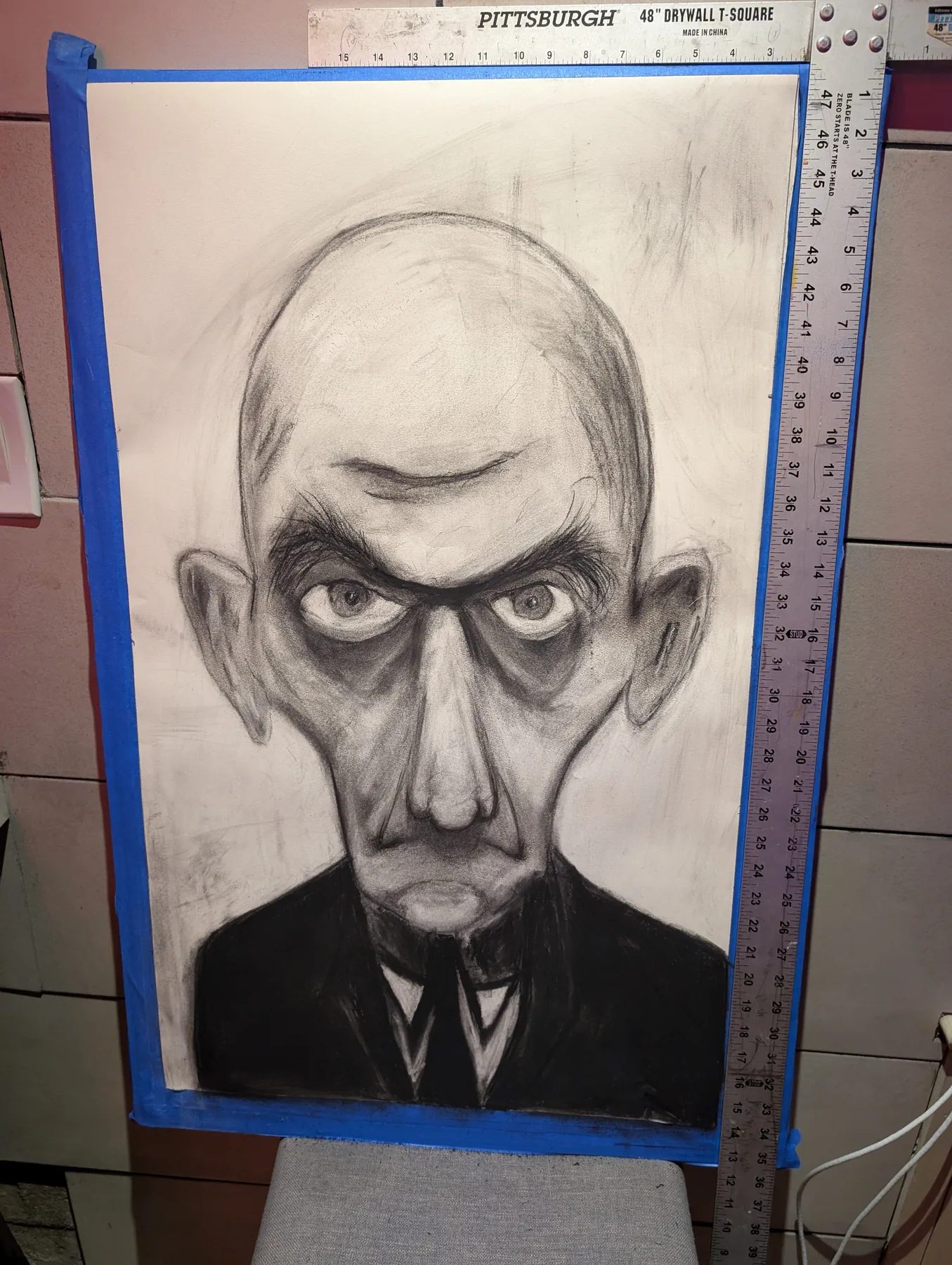 Framed charcoal skull portrait